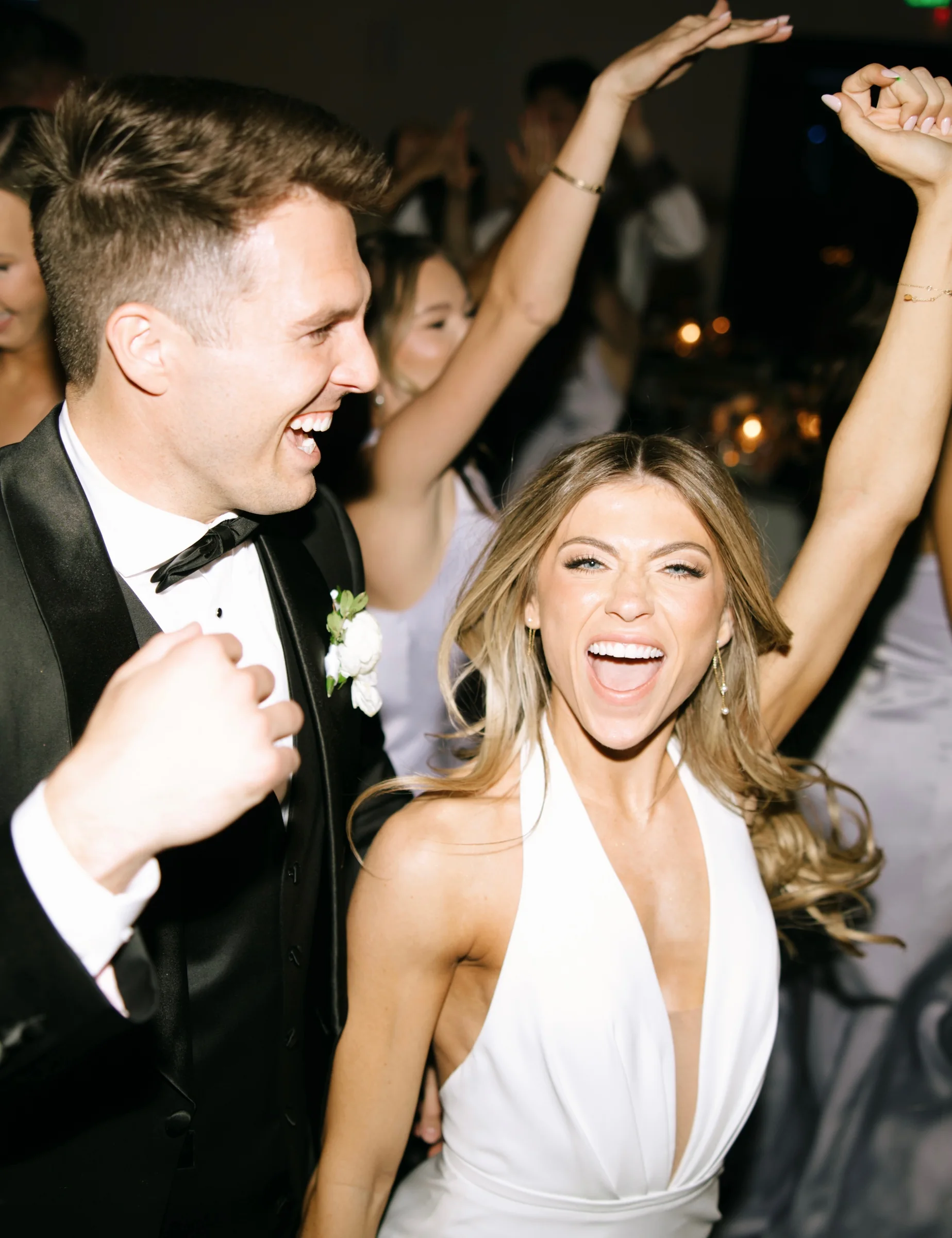 Wedding guests celebrating together on the dance floor