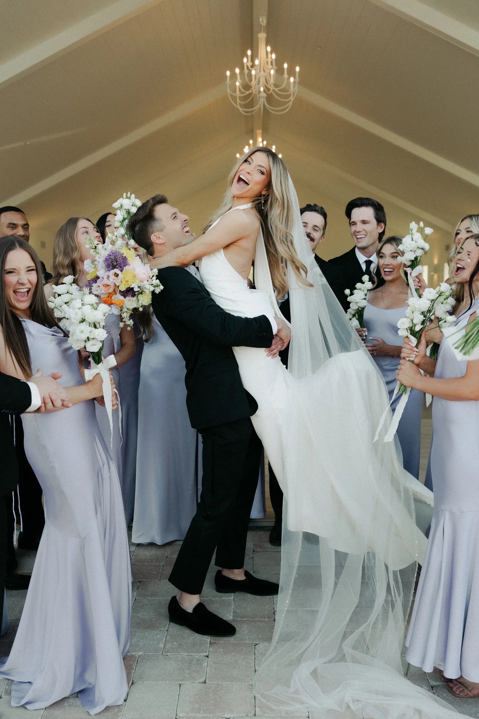 Wedding party celebrating with the newlyweds