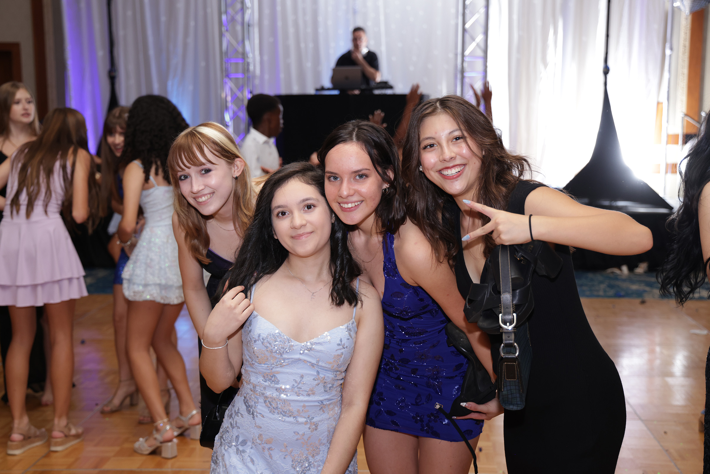 Party guests smiling on the dance floor