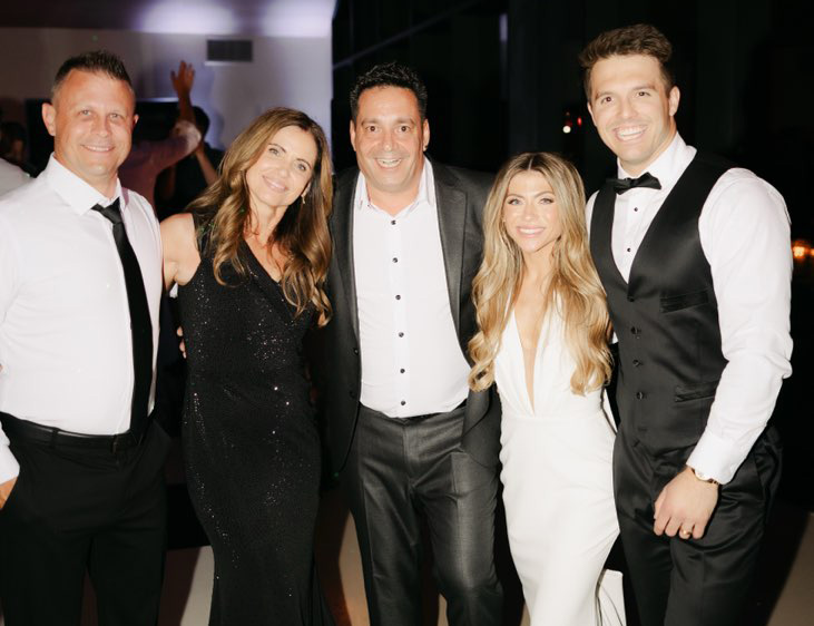 Five friends celebrating at a reception